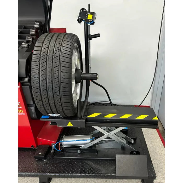 Corghi TT80 Pneumatic Wheel Lift for Wheel Balancers In Use