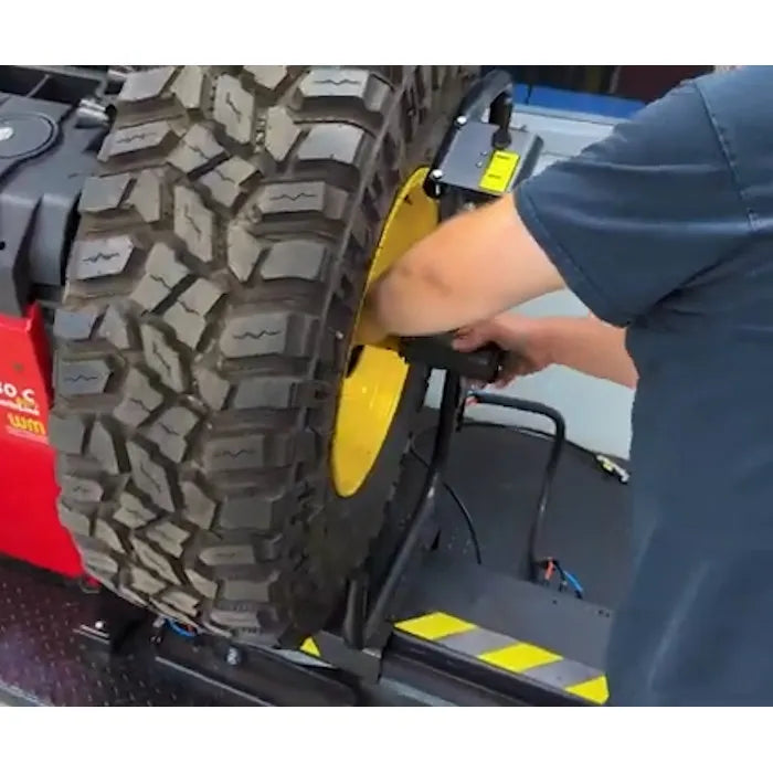 Corghi TT80 Pneumatic Wheel Lift for Wheel Balancers In Use