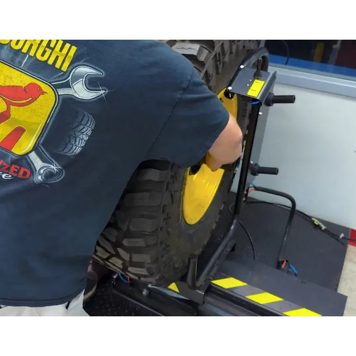 Corghi TT80 Pneumatic Wheel Lift for Wheel Balancers In Use