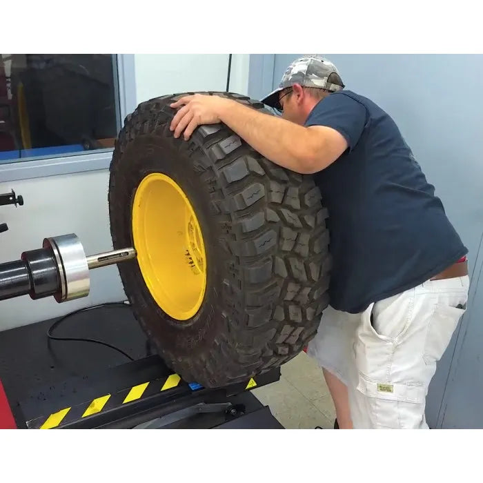 Corghi TT80 Pneumatic Wheel Lift for Wheel Balancers In Use