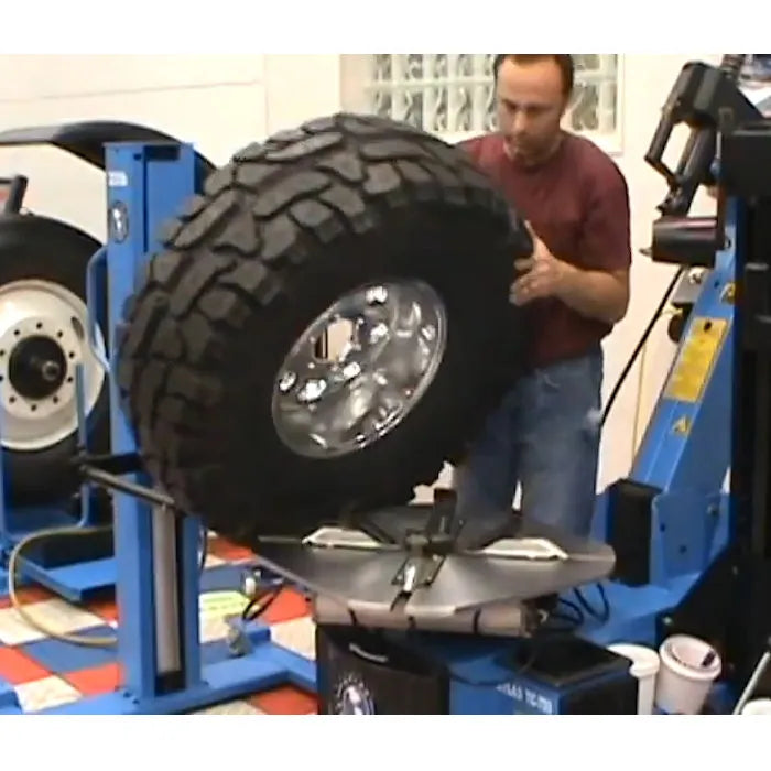 Atlas AEZWL Pneumatic Offset Portable Wheel Lift In Use with Tire Changer
