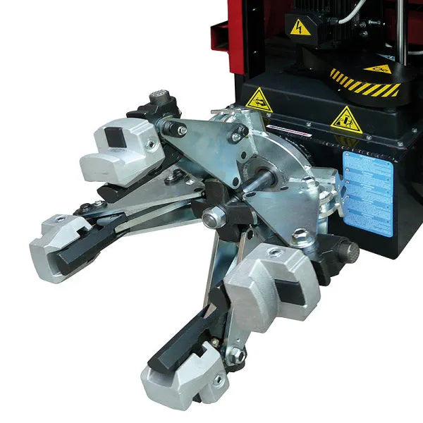 Hydraulic clamping firmly secures the wheel to the tire changer.